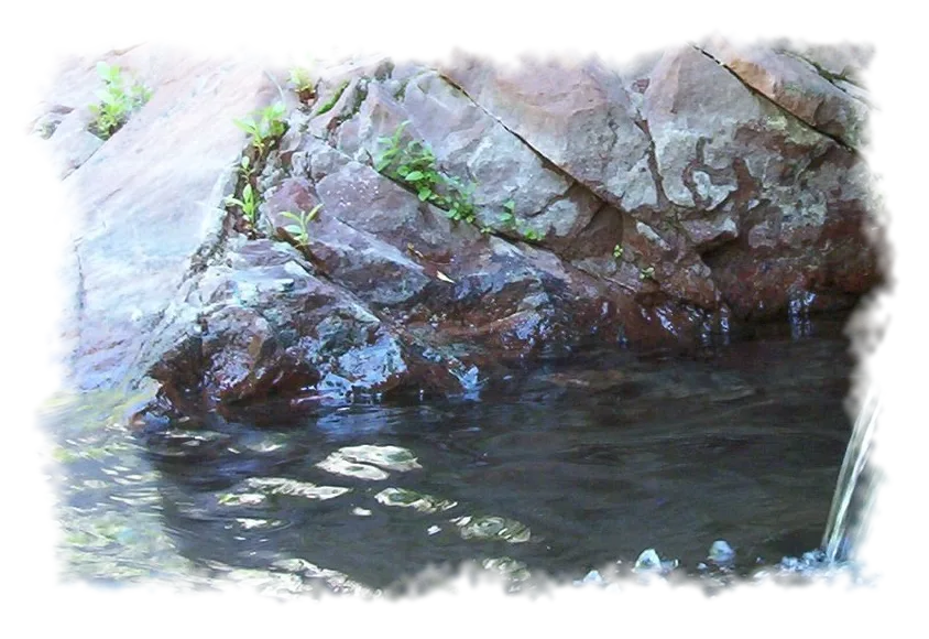 Warm spring water against red rock